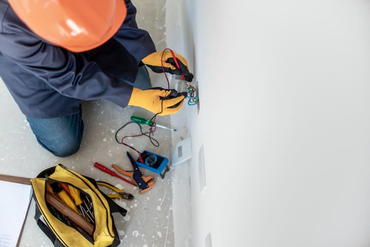 Electrician Using Multimeter