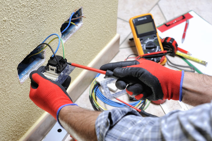 Electrician Testing an Outlet