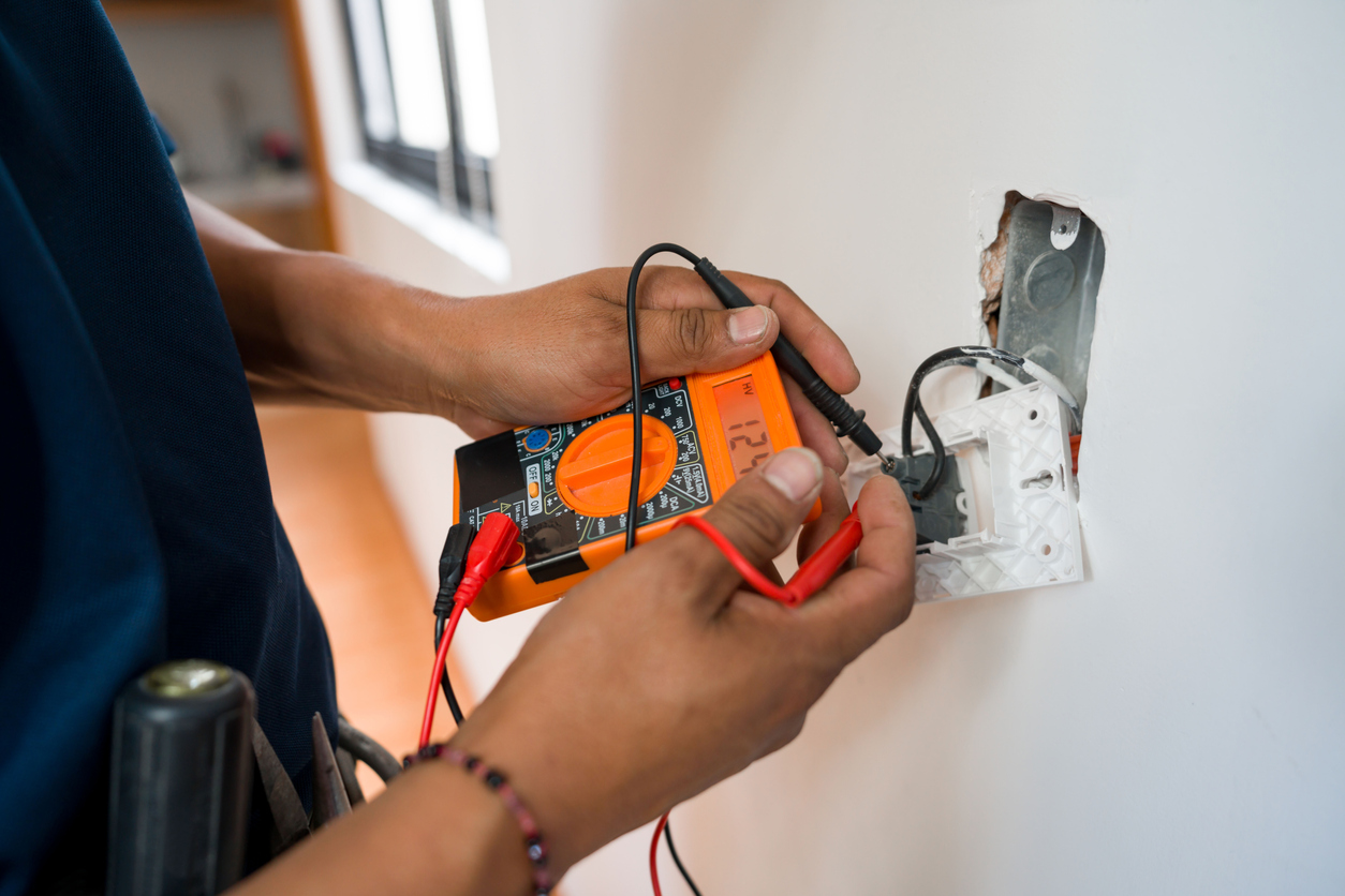 Electrician Fixing an Outlet