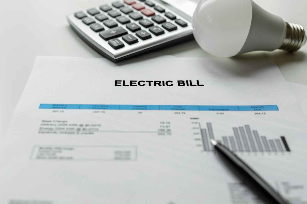 Electric bill charges on a piece of paper
