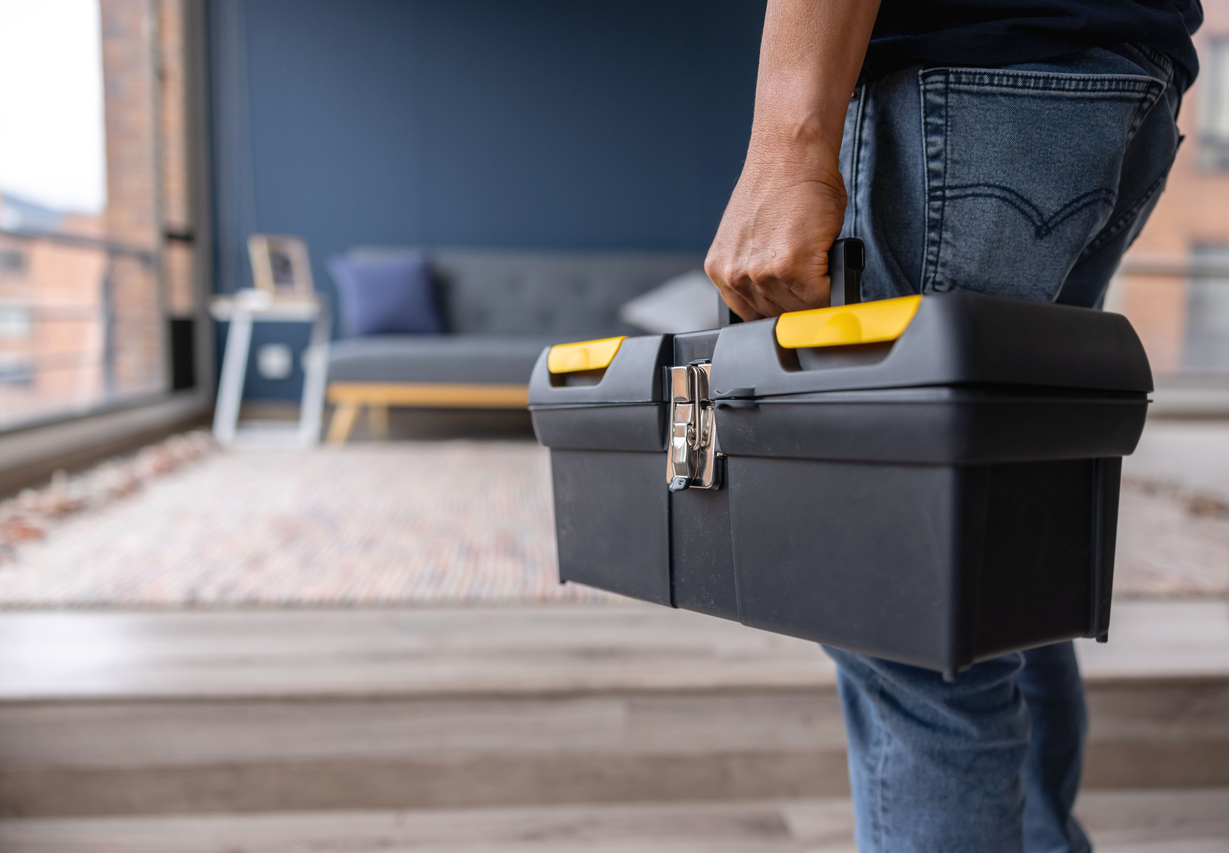 Electrician Carrying Toolbox