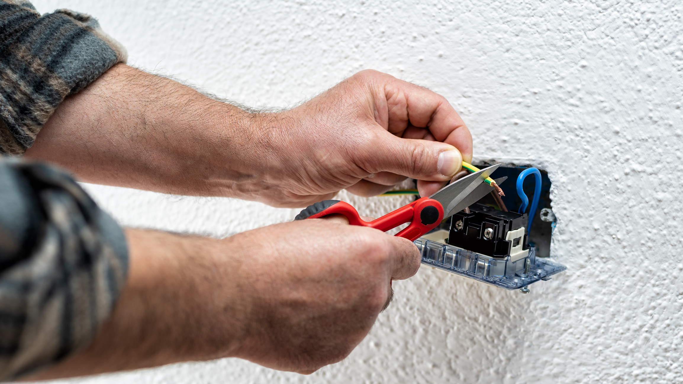 Electrician Working on Outlet