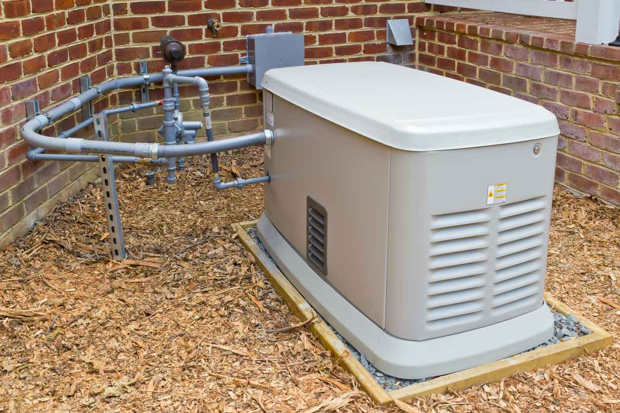 A home generator that provides electricity during a power outage. It is connected to a propane gas supply.