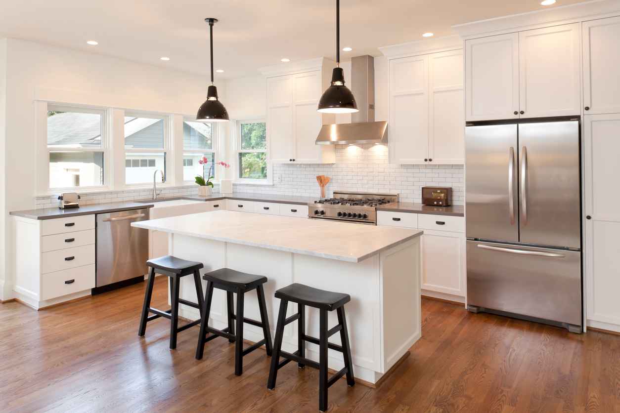 New kitchen in modern luxury home with pendant lights