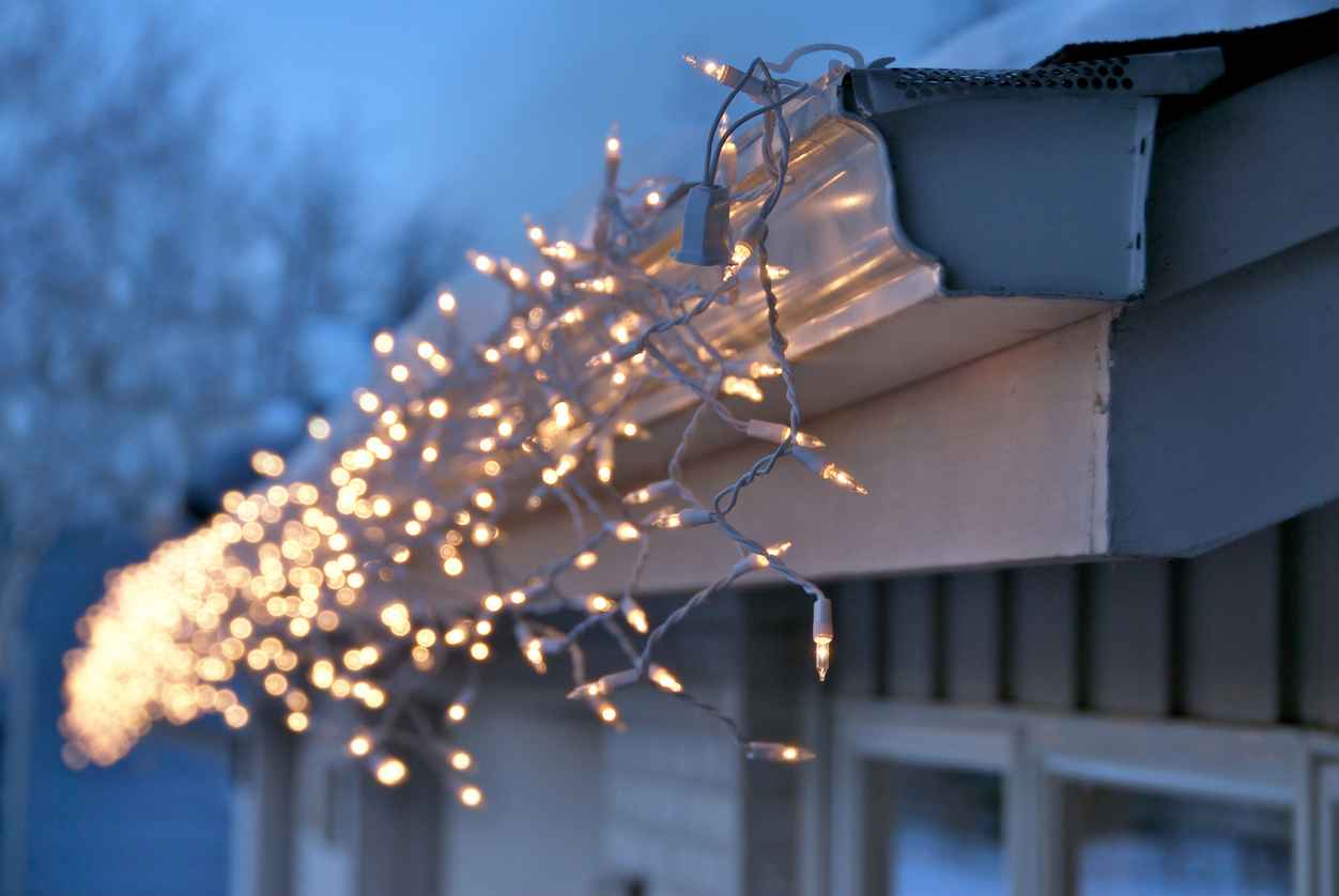 Icicle Christmas lights on a house in the winter