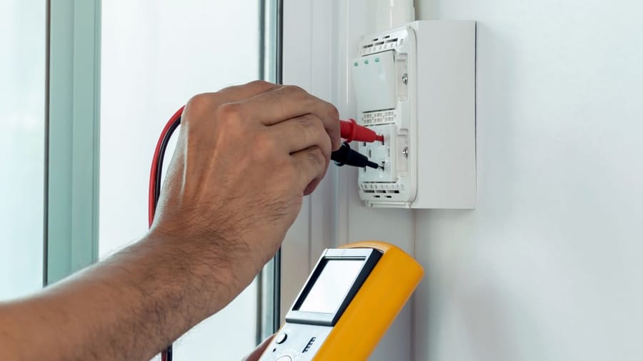 electrician using digital meter