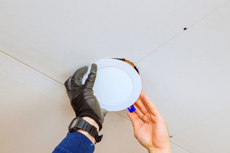 Electrician installed recessed lights in a ceiling